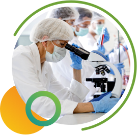 Scientist looking into microscope